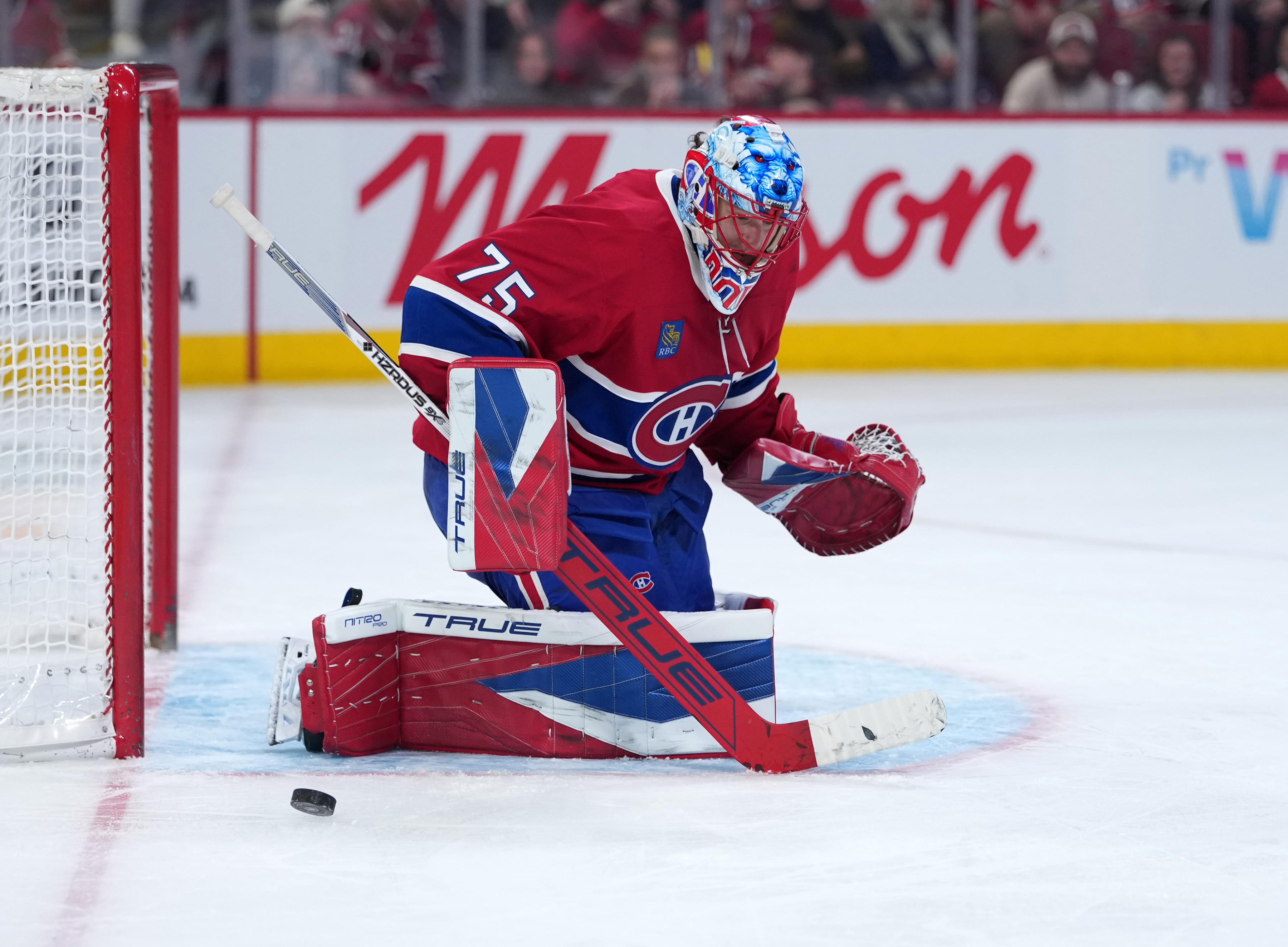 Montreal Canadiens goalie Jakub Dobes (75) makes a save against the Washington Capitals during the third period at the Bell Centre.